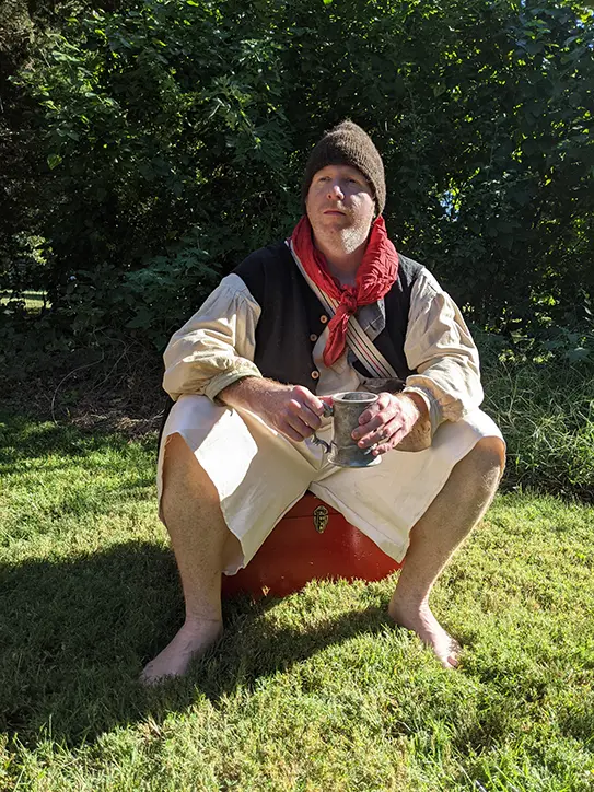 A pirate drinking some ale